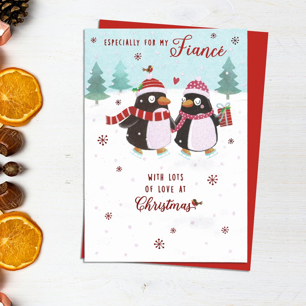 Especially For My Fiancé With Lots Of Love At Christmas Card Showing Two Penguins Ice Skating. With Added Sparkle And Red Envelope