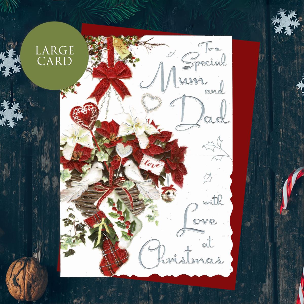 To A Special Mum And Dad With Love At Christmas Featuring A Decorated Dove's Nest With Ribbons, Baubles And Stocking. Finished With Silver Foiled Lettering, Red Glitter And Printed Colour Insert