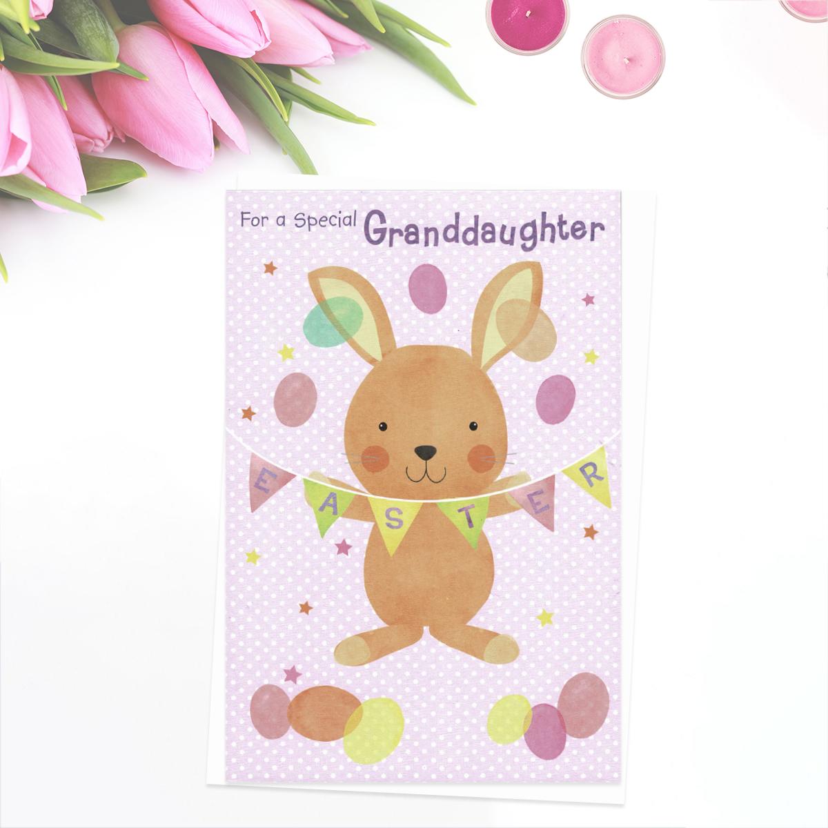 ' For A Special Granddaughter' Easter card showing Cute Rabbit with bunting and eggs. Complete with yellow envelope