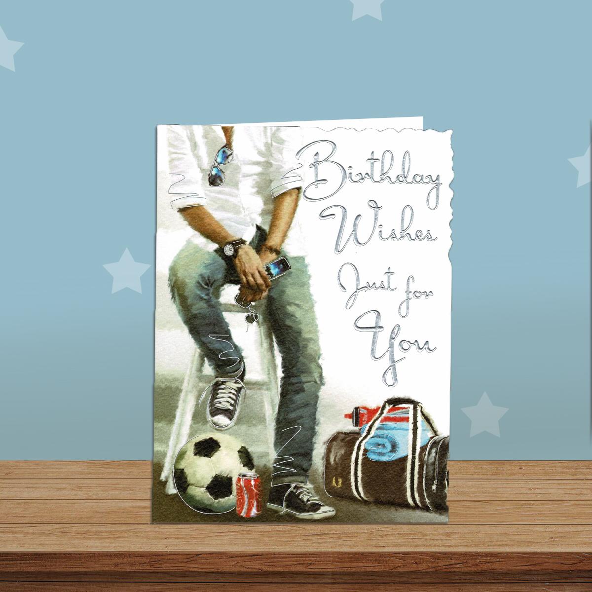 Football And Kitbag Themed Birthday Card Alongside Its White Envelope