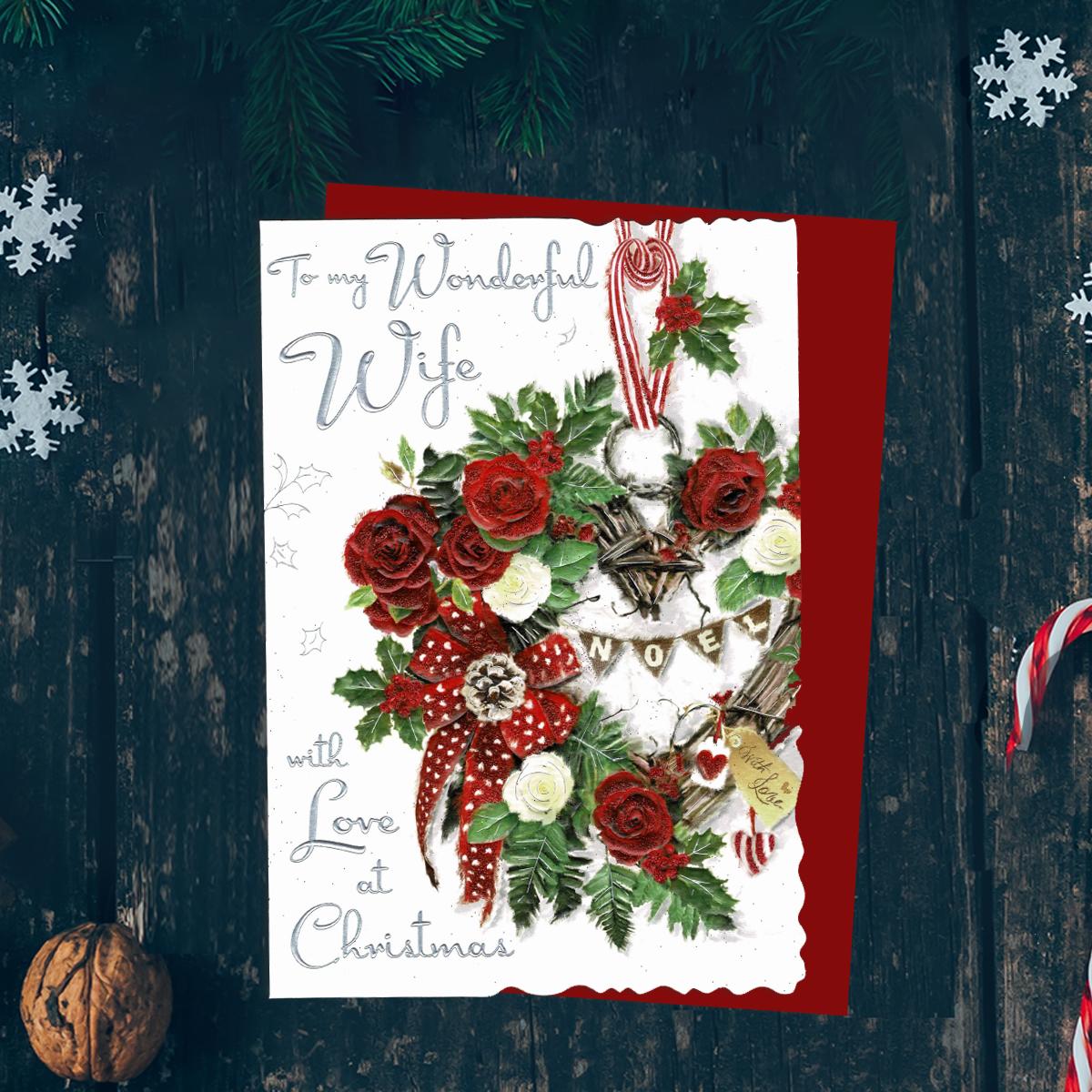To My Wonderful Wife With Love At Christmas Features A Wicker Heart Of Roses, Ribbons And Cones. Finished With Silver Foil Lettering, Red Glitter And Red Envelope