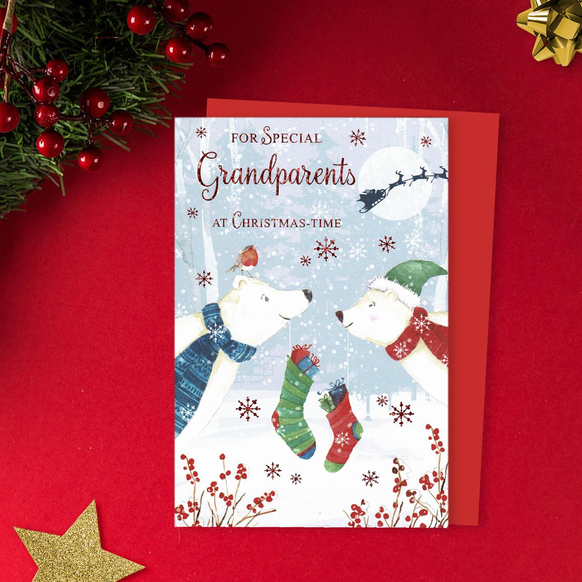 For Special Grandparents At Christmas - Time Featuring two polar Bears With hanging stockings! Finished With Red Foil Detail And Red Envelope