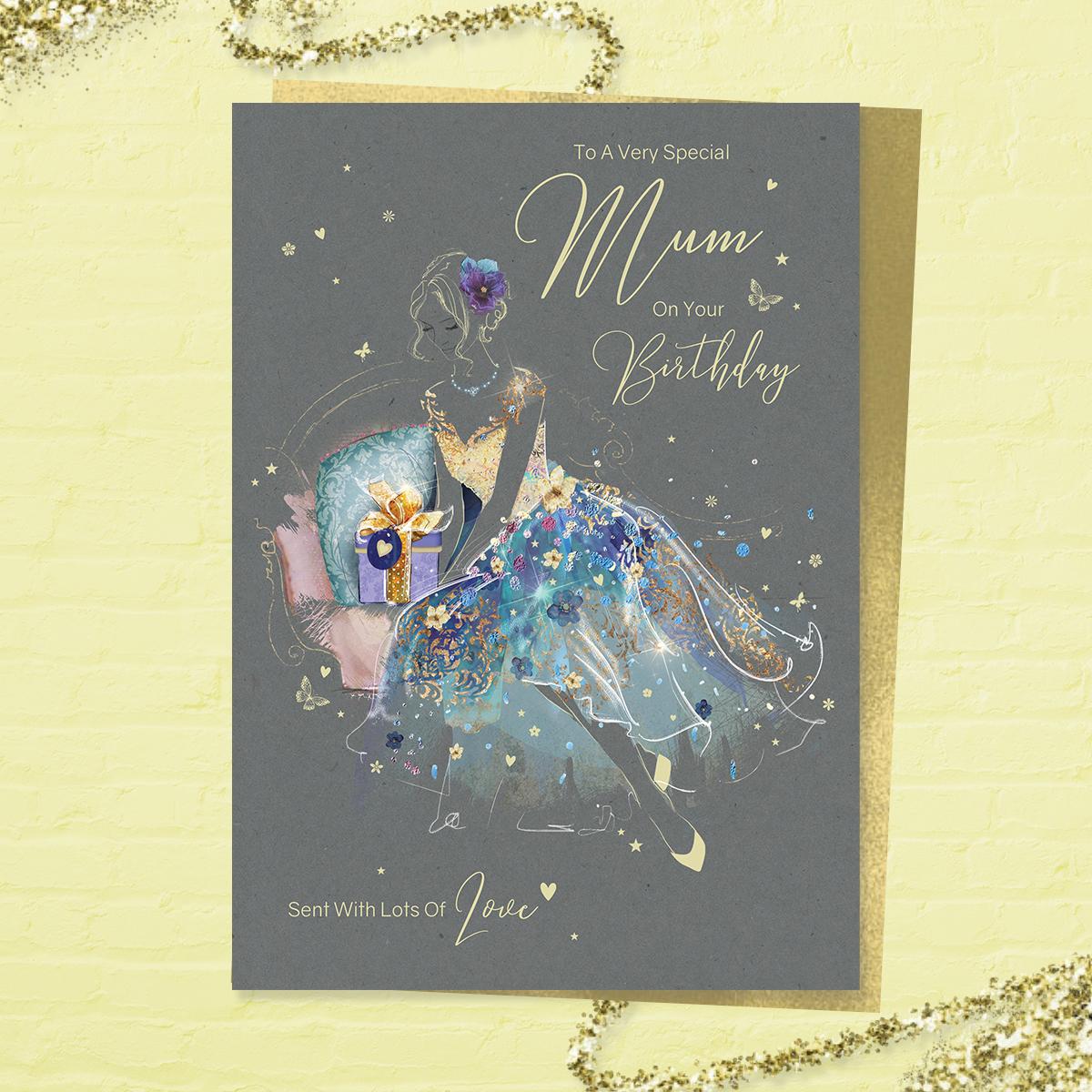 'Just For You Mum On Your Birthday' larger card from the 'Grace' range. Beautiful Lady in A Blue And Gold Dress. Added Sparkle And Gold Foil Detail. Printed Insert With Colour Image And Heartfelt Verse. Complete With Gold Colour Envelope