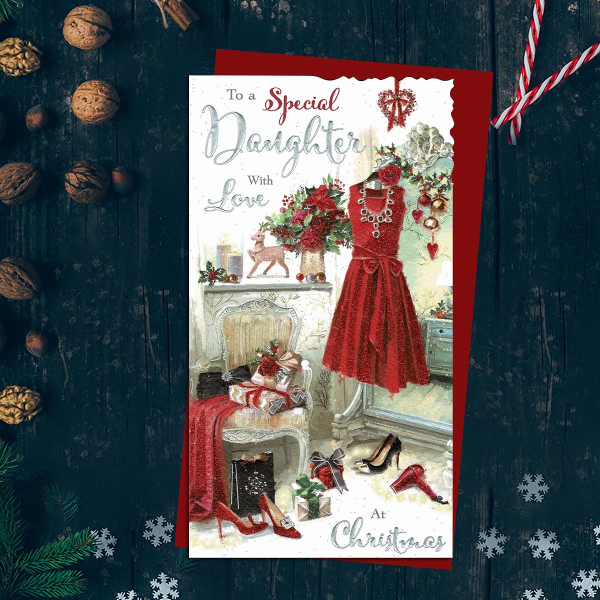To A Special Daughter With Love At Christmas Featuring A Dressing Room With Beautiful Red Sparkly Dress, Shoes, Poinsettias And Gifts. Finished With Silver Foil And Red Glitter Detail And Red Envelope
