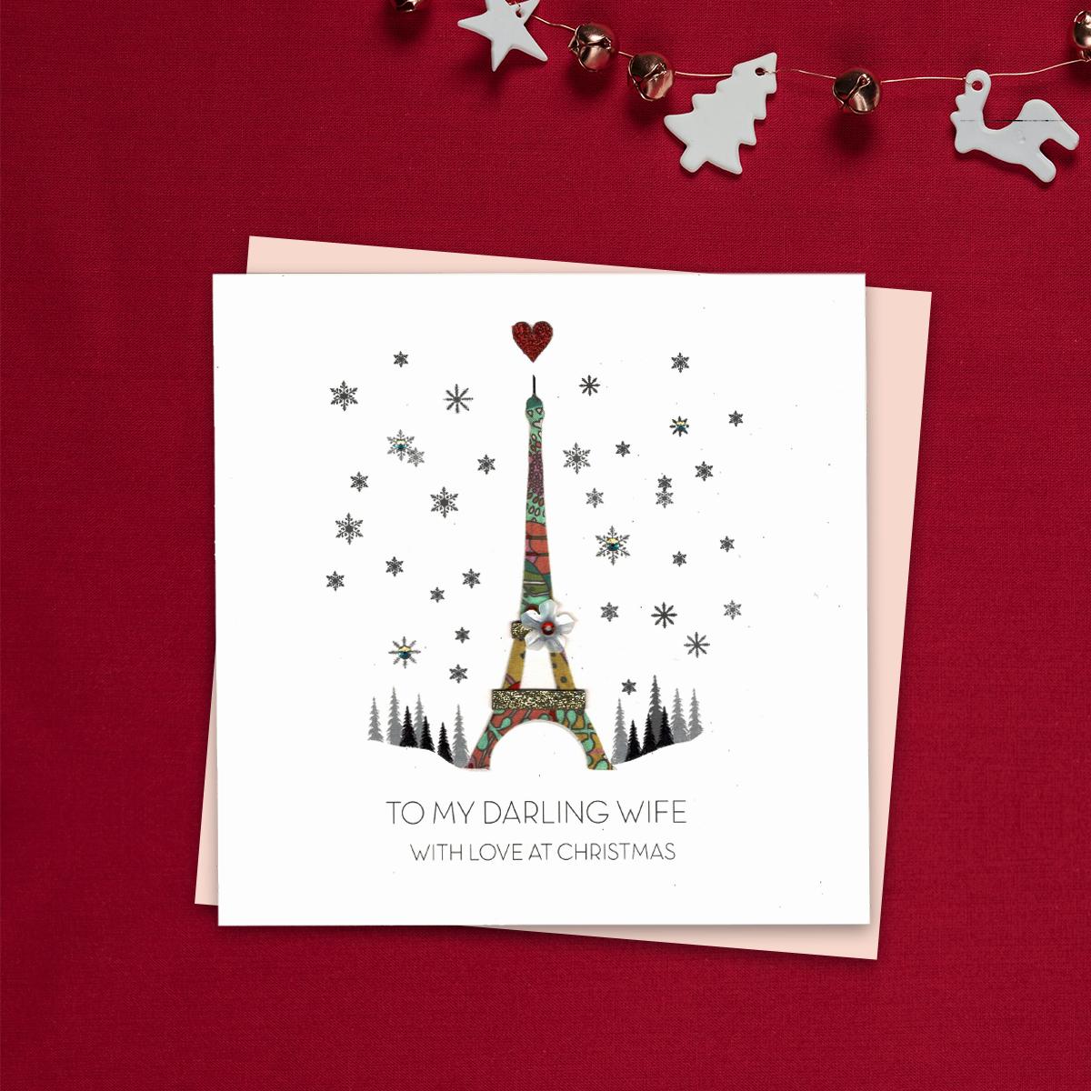 To My Darling Wife With Love At Christmas Featuring a Beautiful Decoupage Eiffel Tower. Finished With Gold Glitter Accents And Jewel Embellishments. Complete With Blush Coloured Envelope