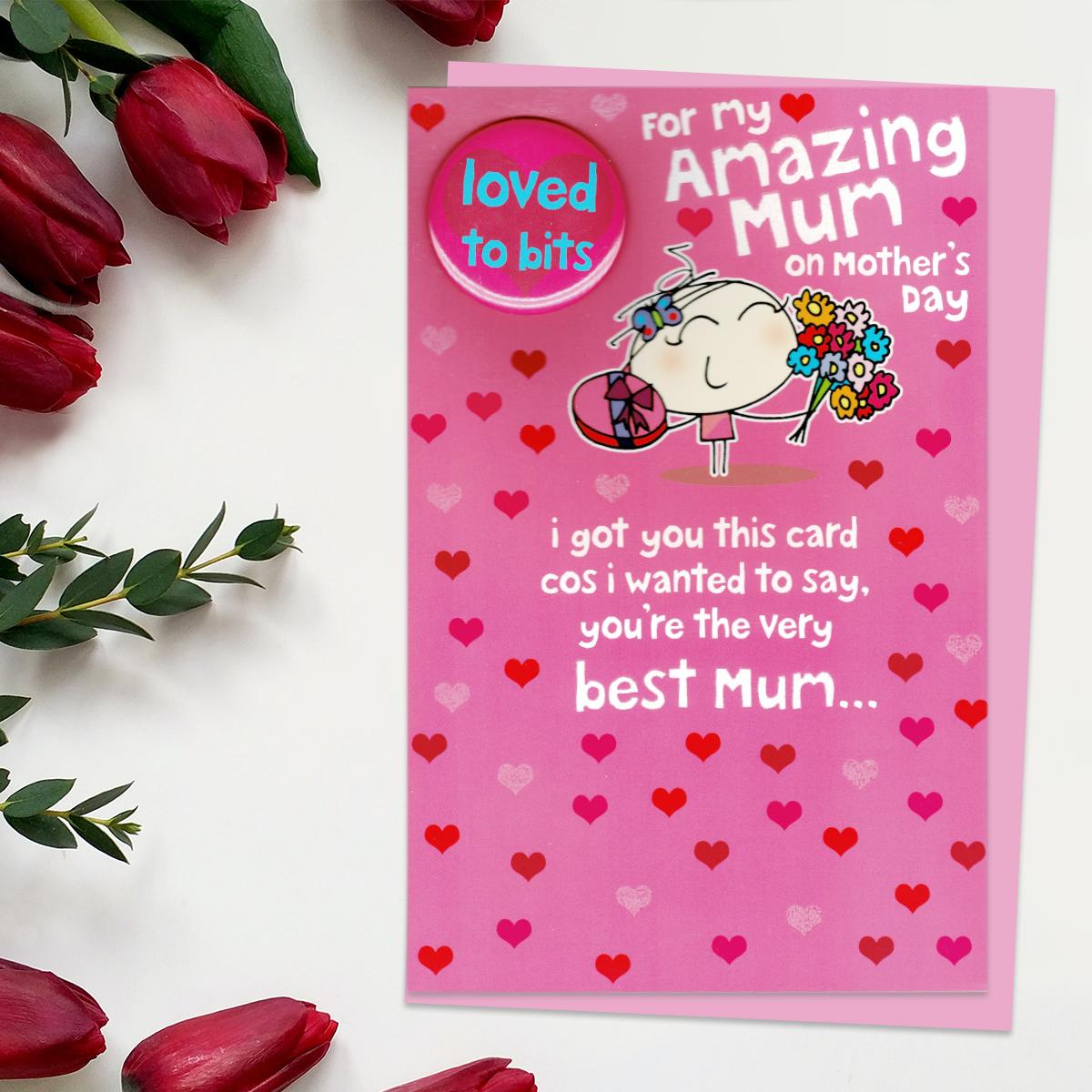 'For My Amazing Mum On Mother's Day' Card Featuring A Cartoon Girl With Chocolates And Flowers. With 'Loved To Bits' Badge Attached. Complete With Pink Envelope