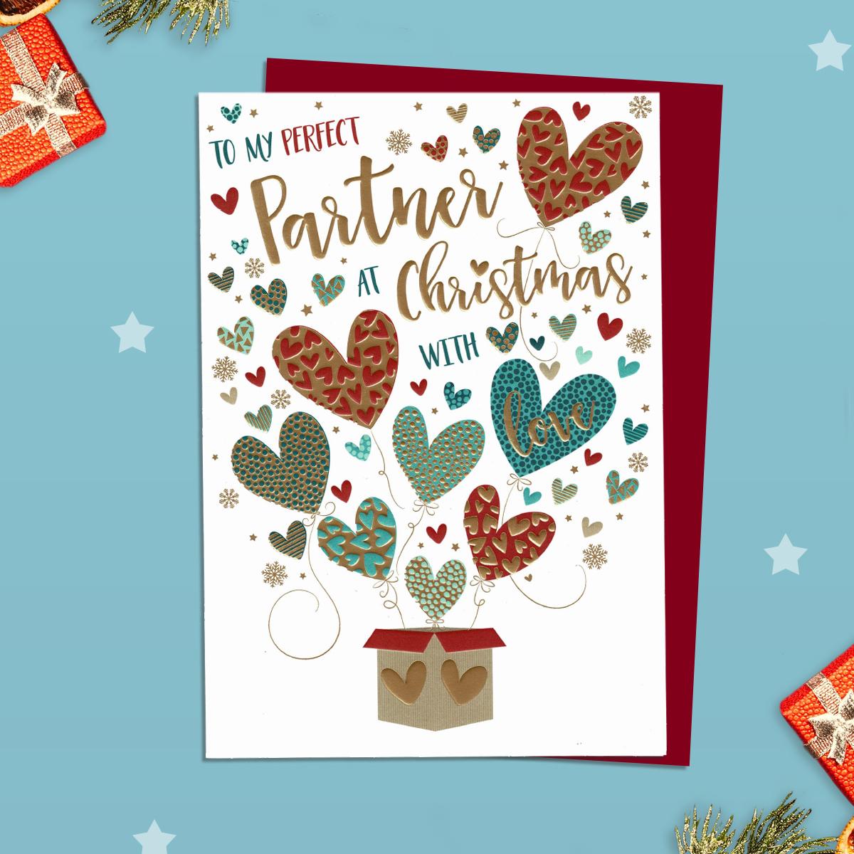 Partner Christmas Card Alongside Its Red Envelope