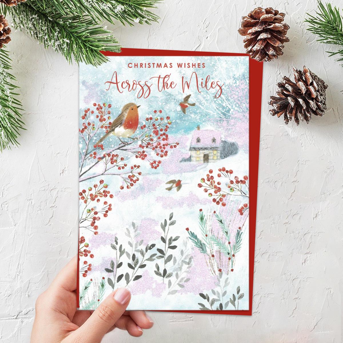 Christmas Wishes Across the Miles Featuring Robins In A Snowy Scene. Finished With Red Lettering, Sparkle And Red Envelope