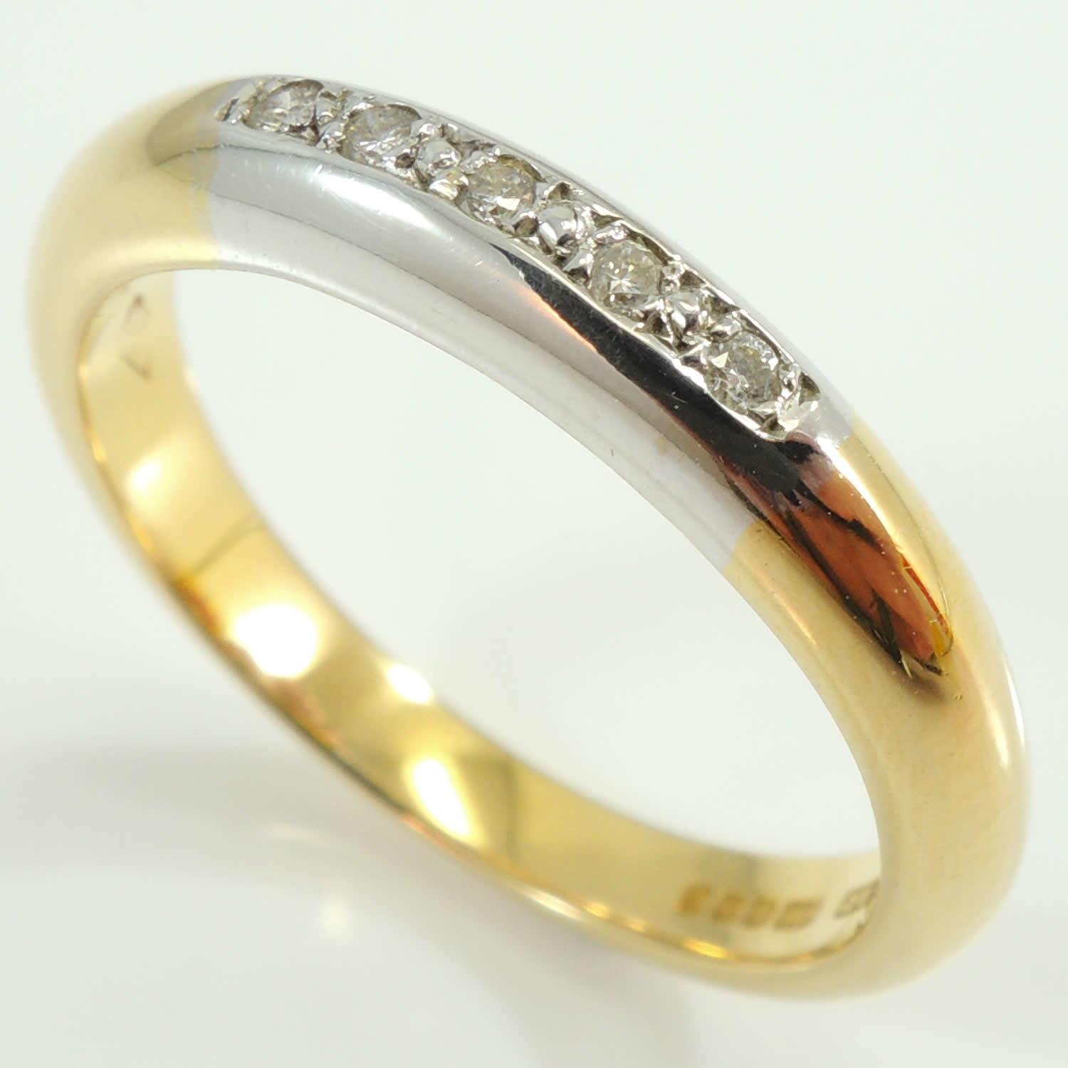 A narrow 18 carat gold wedding ring SOLD