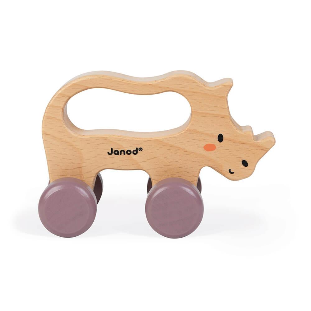 Side view of a push-along toy wood rhino with handle and wheels. White background.