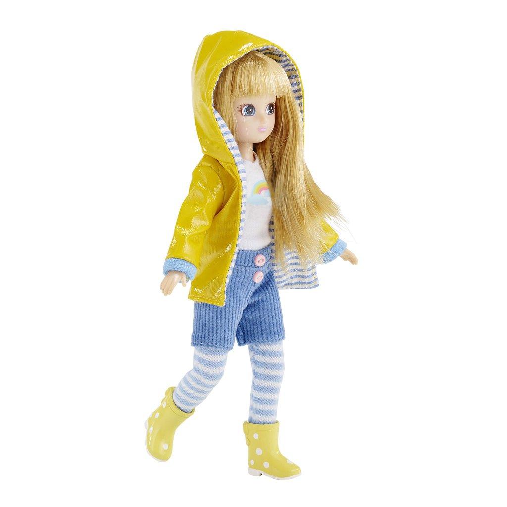 Muddy Puddles Lottie Doll in yellow raincoat with her hood up.