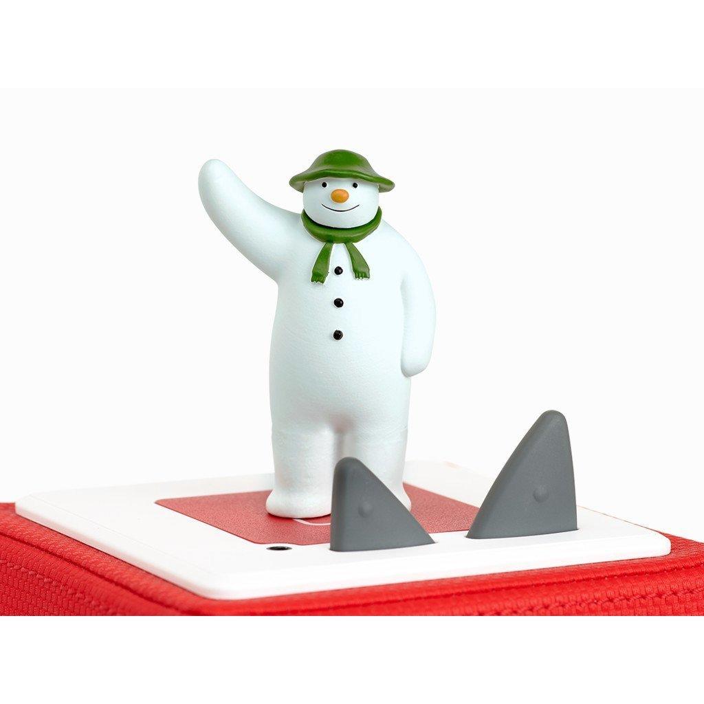 Snowman figure standing on the top section of a red Toniebox.