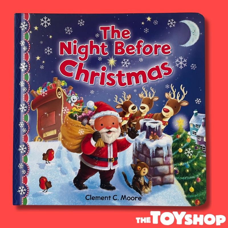 Colourful Christmas book with Santa and his reindeer on a snowy rooftop. Santa has a sack over his shoulder and is waving with a black gloved hand. The totles of the book in red reads ' The Night Before Christmas'.