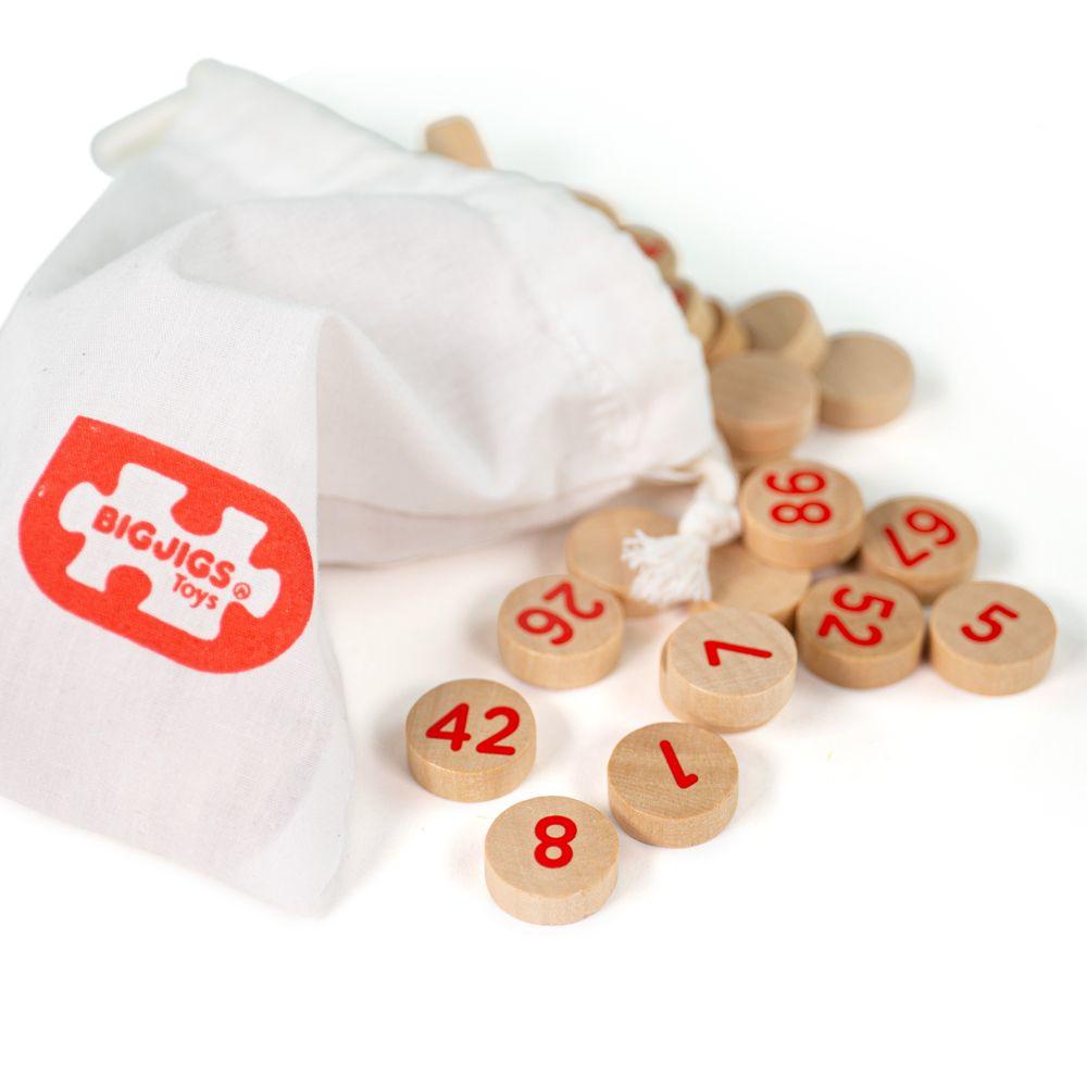 Wooden Bingo numbered pieces and white material pouch.