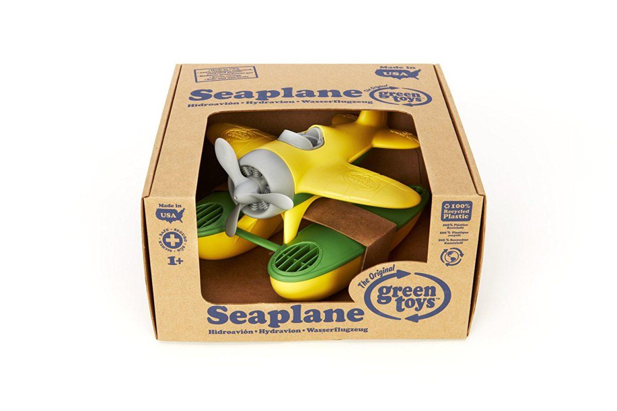 Green Toys Eco-Friendly Seaplane in cardboard packaging. White background.