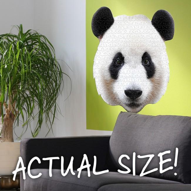 Large panda head jigsaw on wall to show large scale.