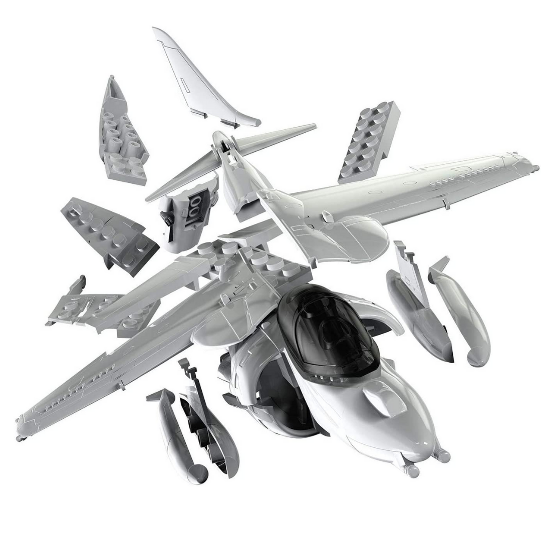 Pieces that make up Harrier model jet. White background.