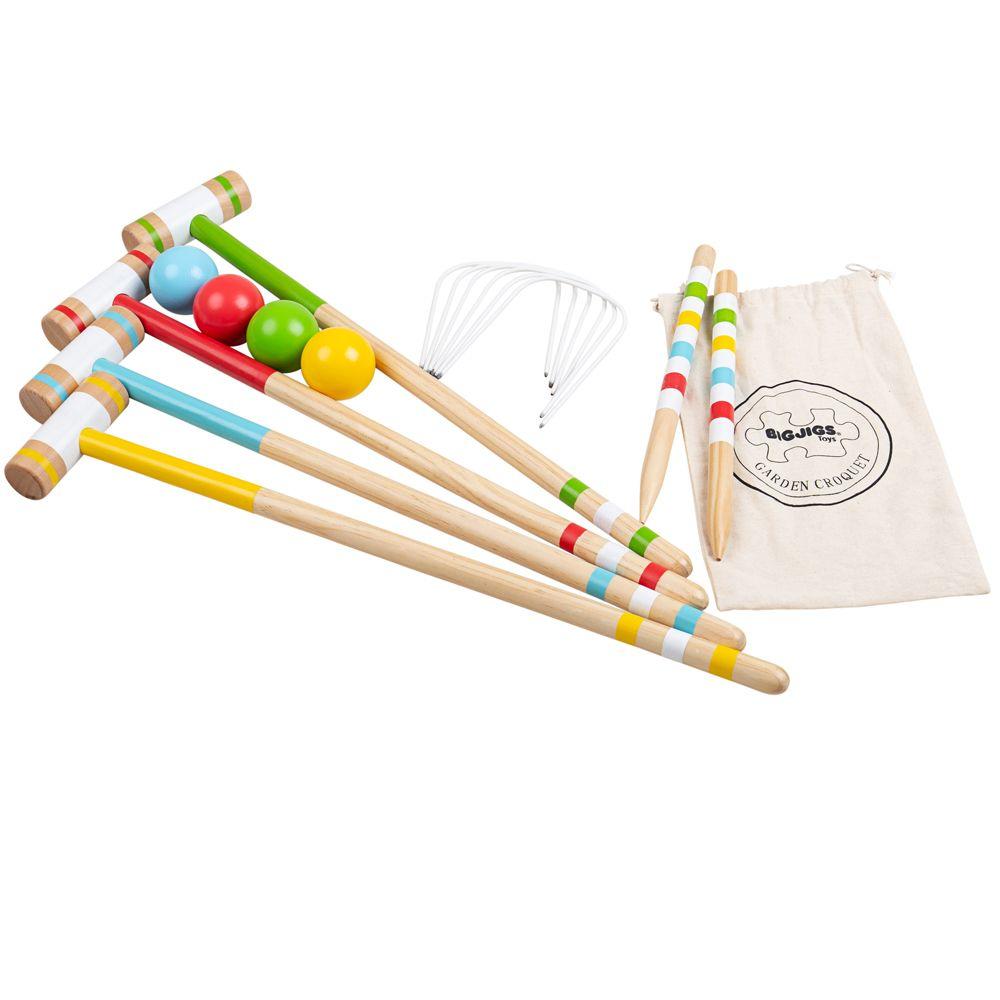 White background. A wooden child's croquet set with 6 hoops, 2 wooden pegs, 4 mallets and 4 balls coloured red, green, yellow and blue.