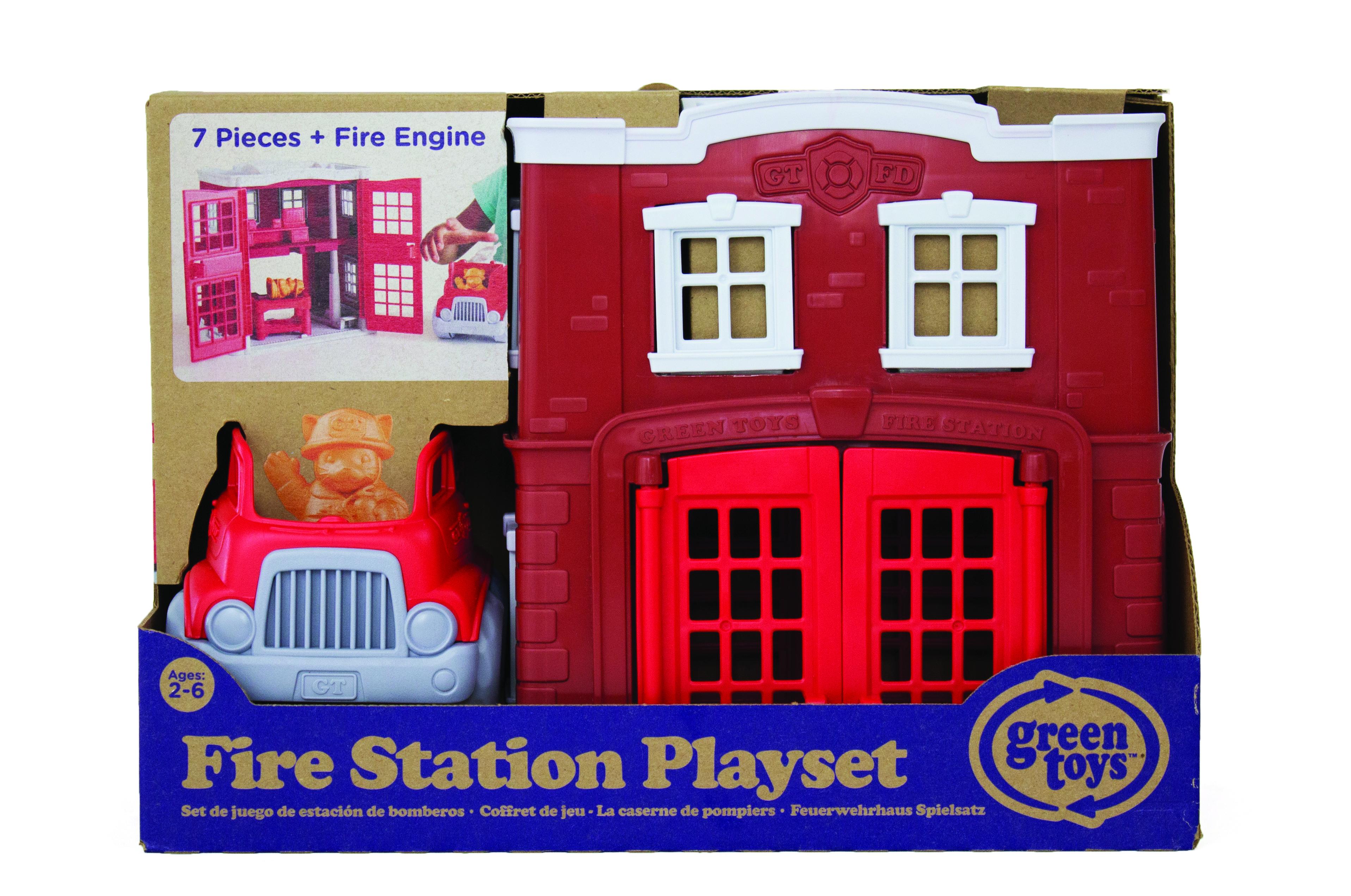 Fire station play-set made from recycled plastic with a red fire engine in manufacturer's packaging.