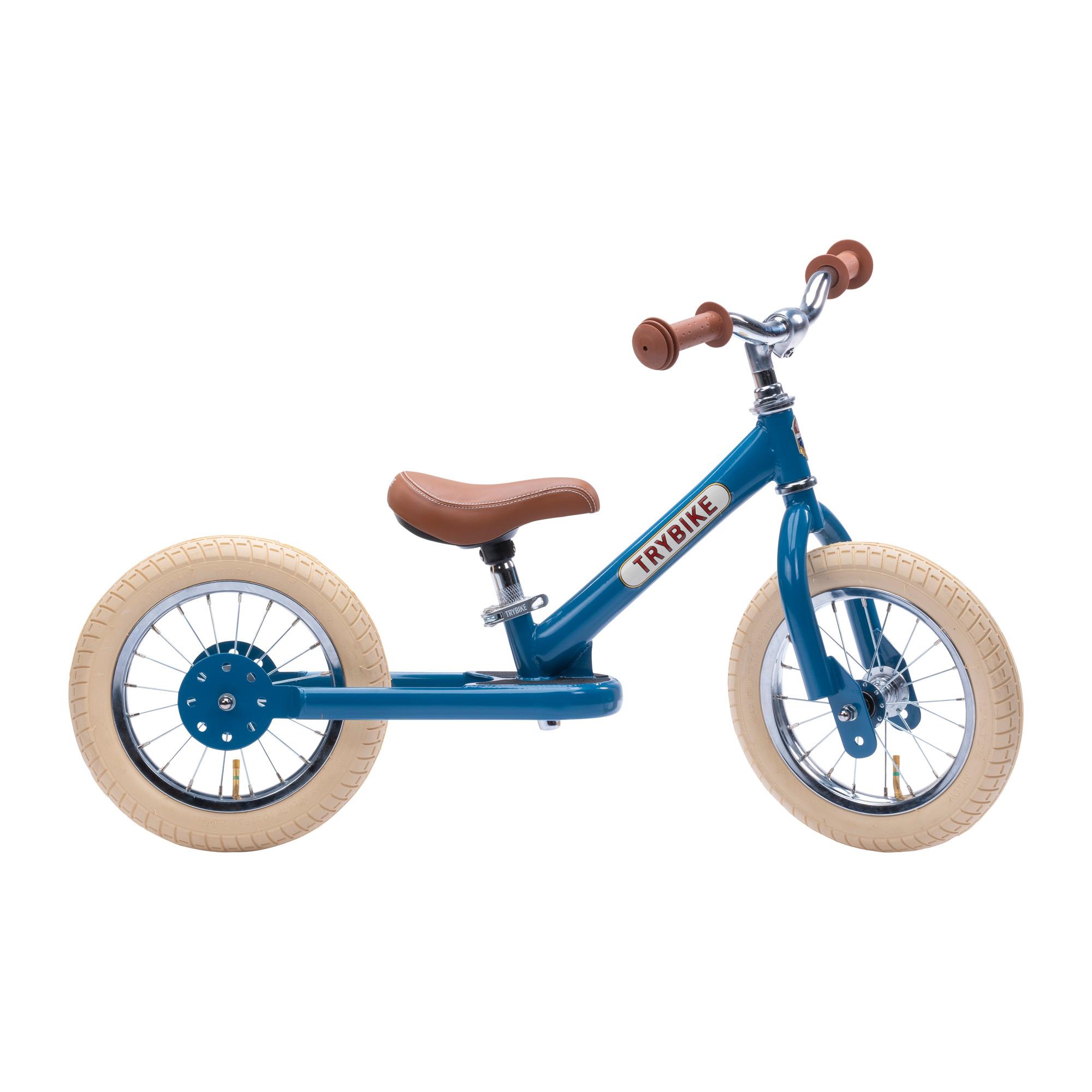 Side view of blue Trybike with cream tires and brown handles and seat.