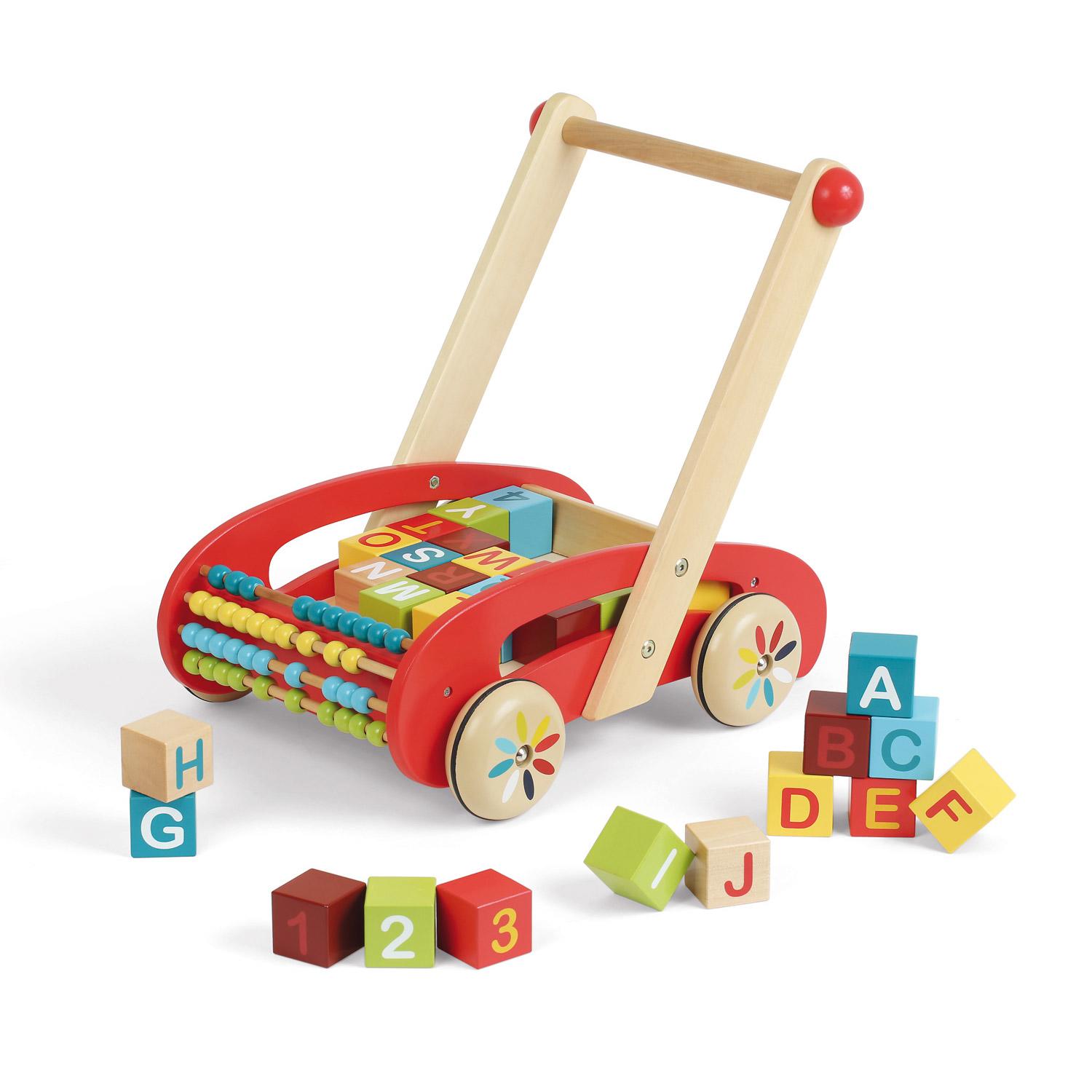 Red wooden baby walker with colourful building blocks with letters and number round about it.