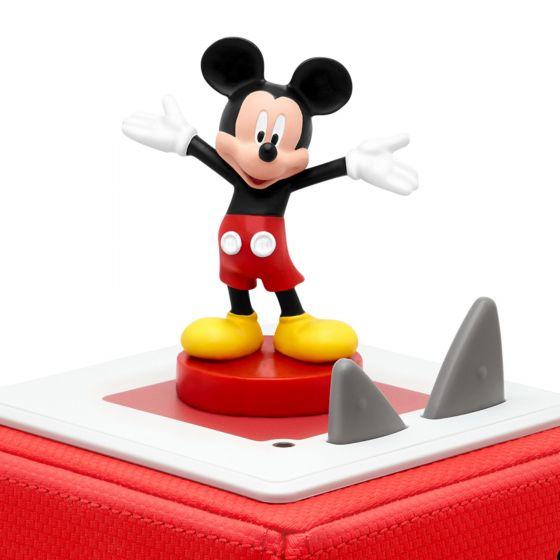 Mickey Mouse with his arms out wide, yello shoes standing on top of red Toniebox.