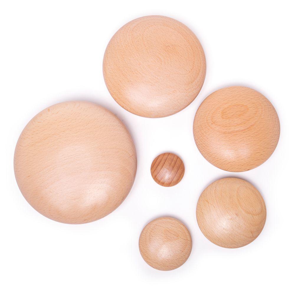 The smooth wooden pebbles flat on a white surface.