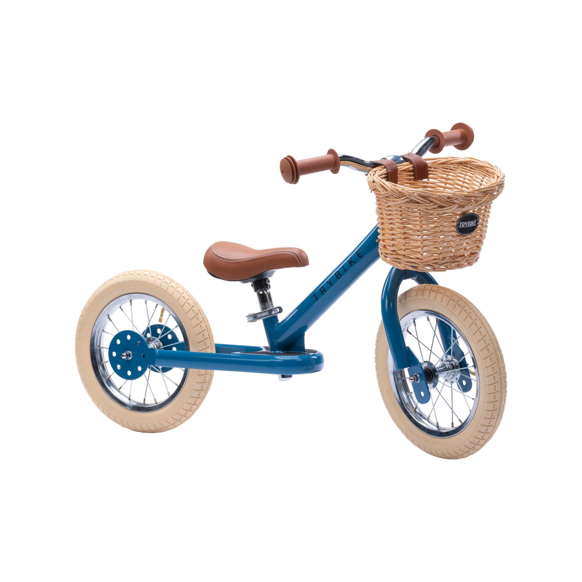 Blue Trybike from a front three-quarter view with a wicker basket on the front.