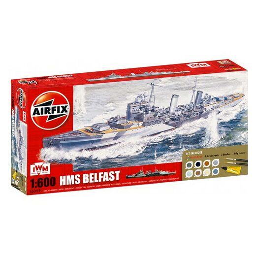 Pack containing the scale model kit of the HMS Belfast ship. Whitebackground.