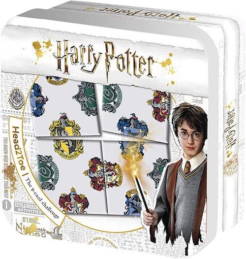White rectangular tin box with gold coloured decoration containing Harry Potter puzzle.