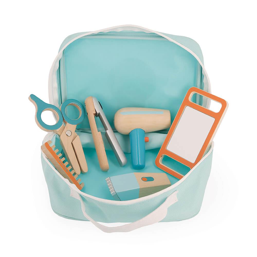 The wooden pieces of the child's hairdresser set within the blue carry case.