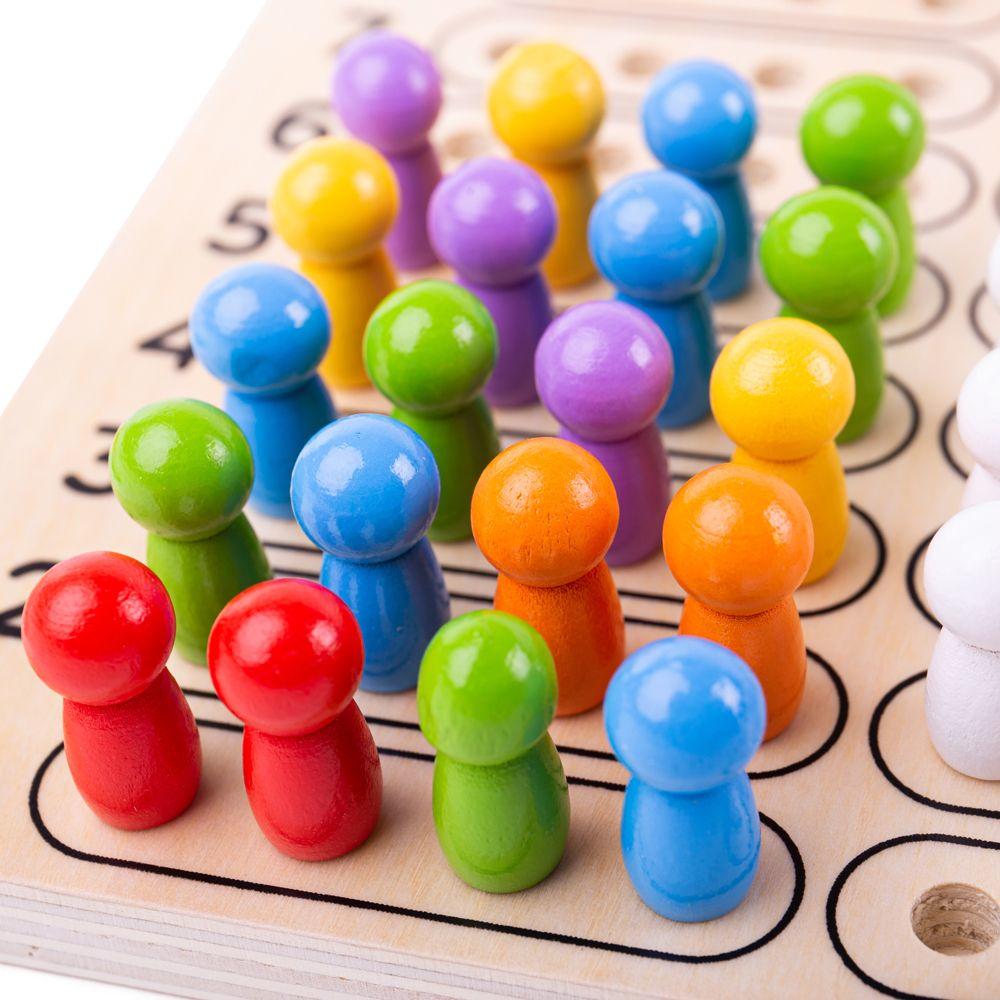 Close up of the Codebreaker wooden board game showing the colourful pegs.
