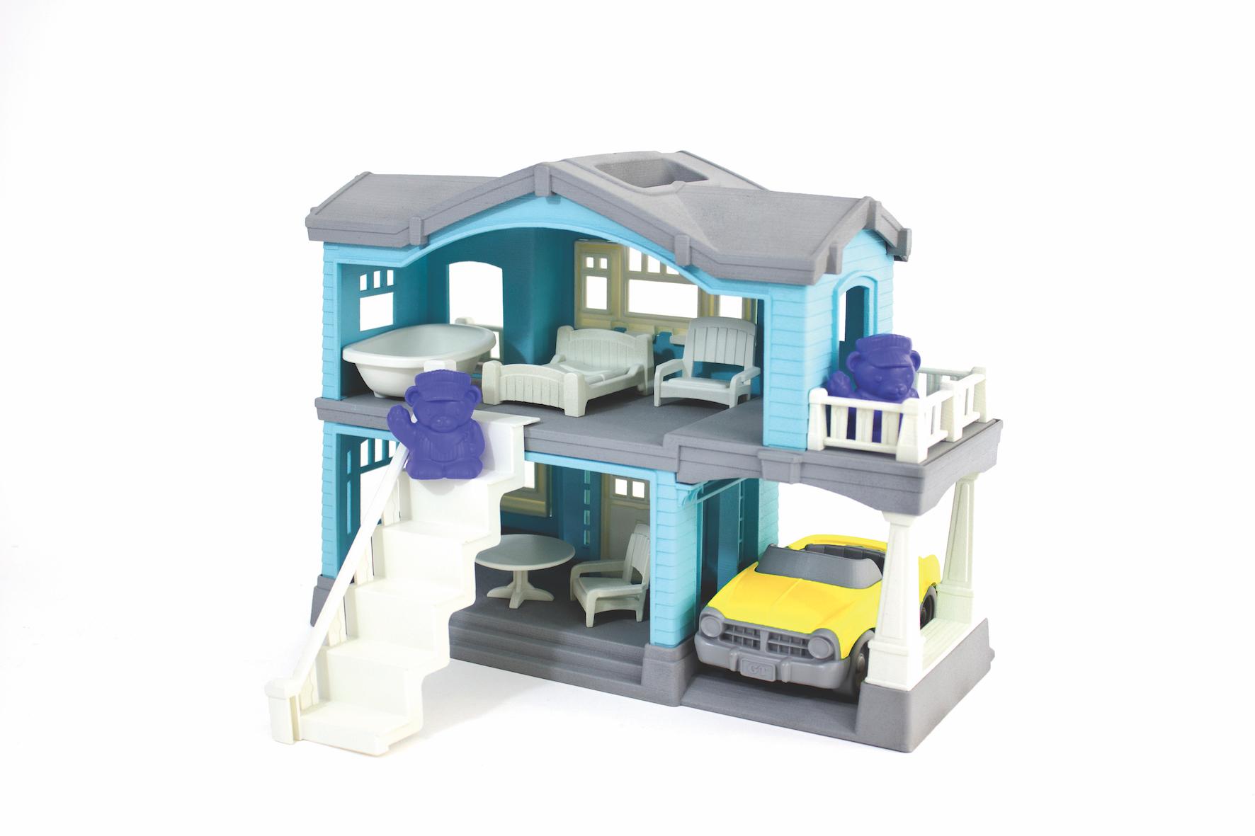 Blue recycled plastic house play-set with car-port and yellow car.