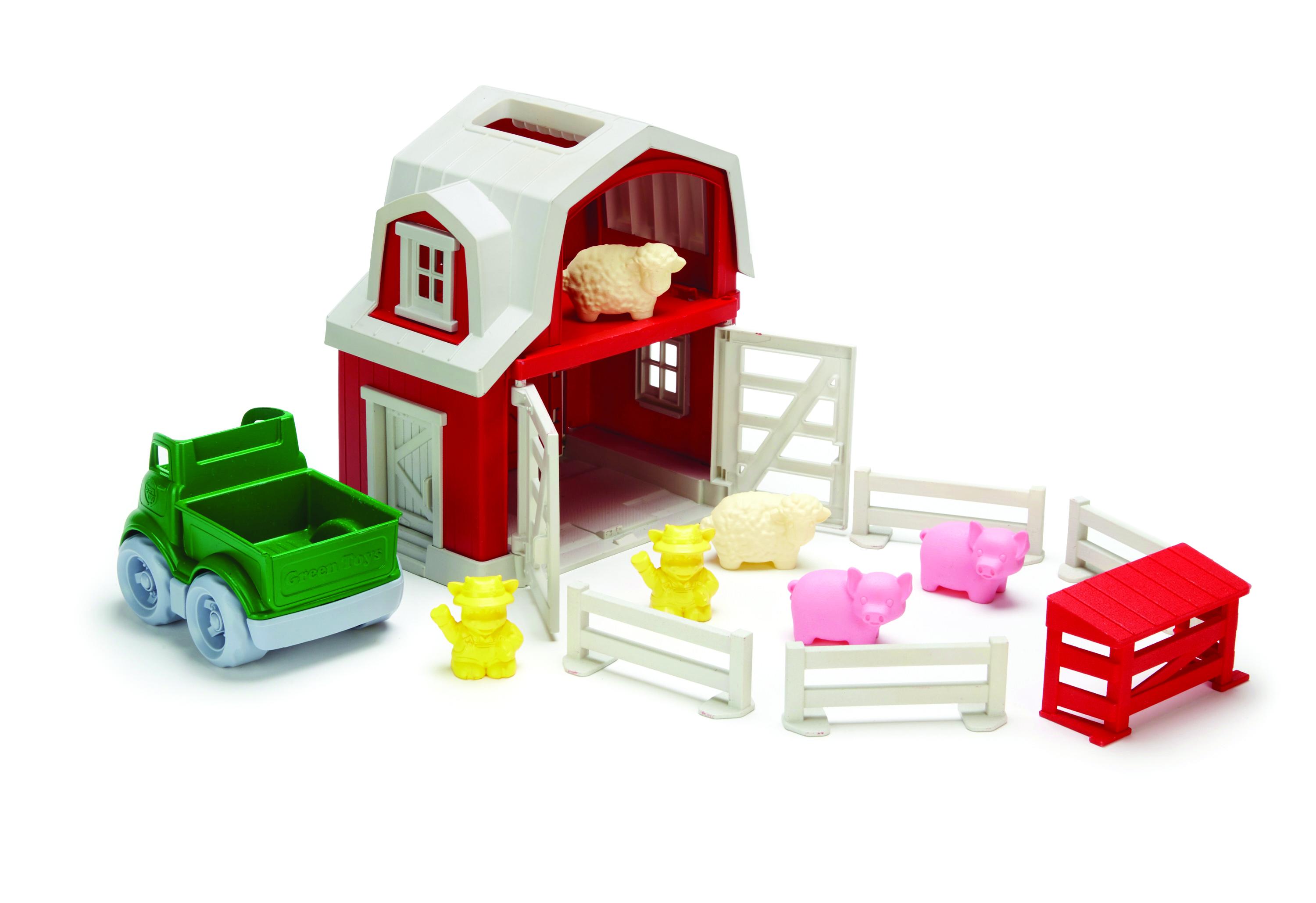 Red plastic farmhouse with fence pieces, farm animals and a green farm pick-up truck.