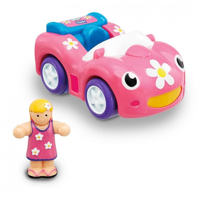 Dynamite Daisy pink car and doll standing beside.