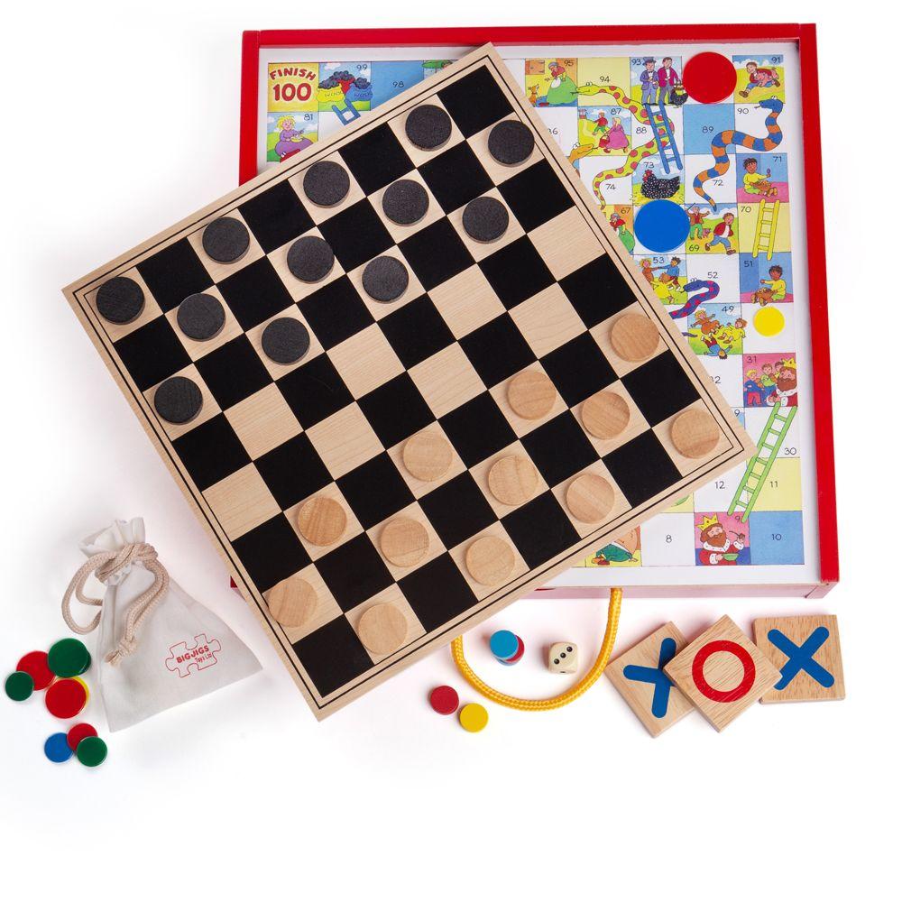 Wooden board games as part of a compendium including chess and snakes and ladders.