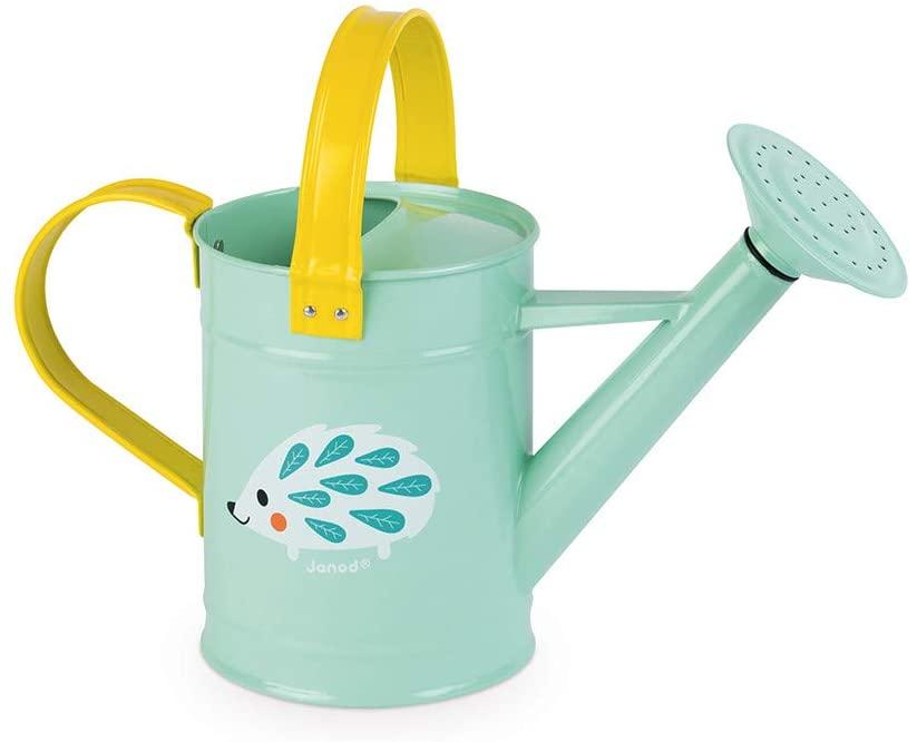 Closer view of mint green metal watering can with yellow handles.