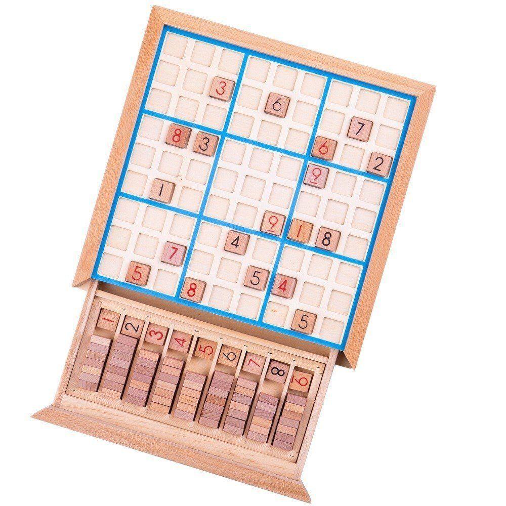 Aerial view of the wooden Sudoku game with pullout drawer with number pieces.