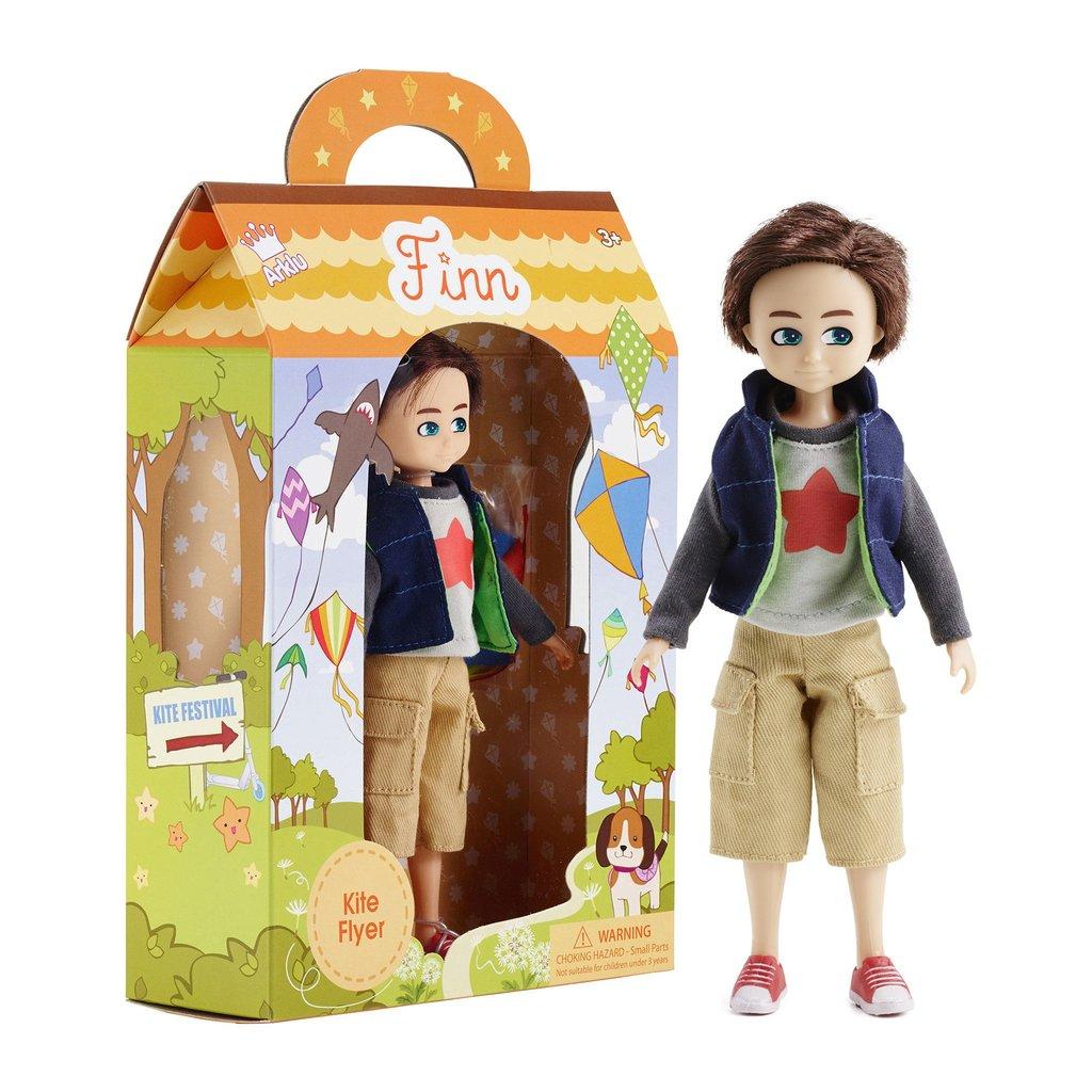 Packaging with boy doll inside and doll standing alongside.