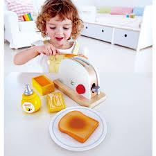 Girl playing with pop up toaster set