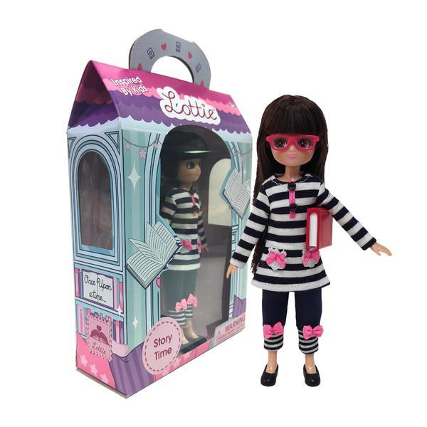 Story Time Lottie doll in a blue and white striped outfit  standing in front of a package containing the same. White background.