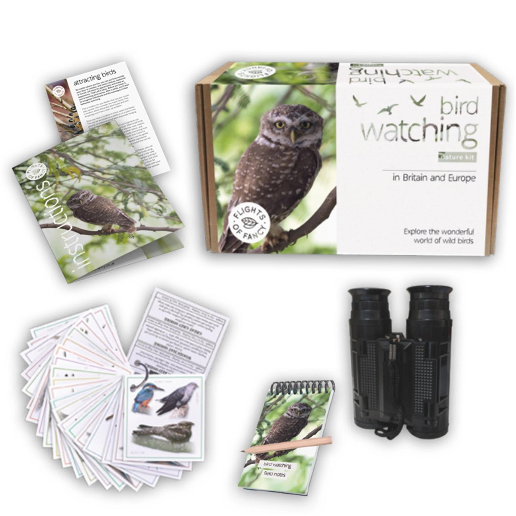 Contents of the bird watching kit including notebook and binoculars.