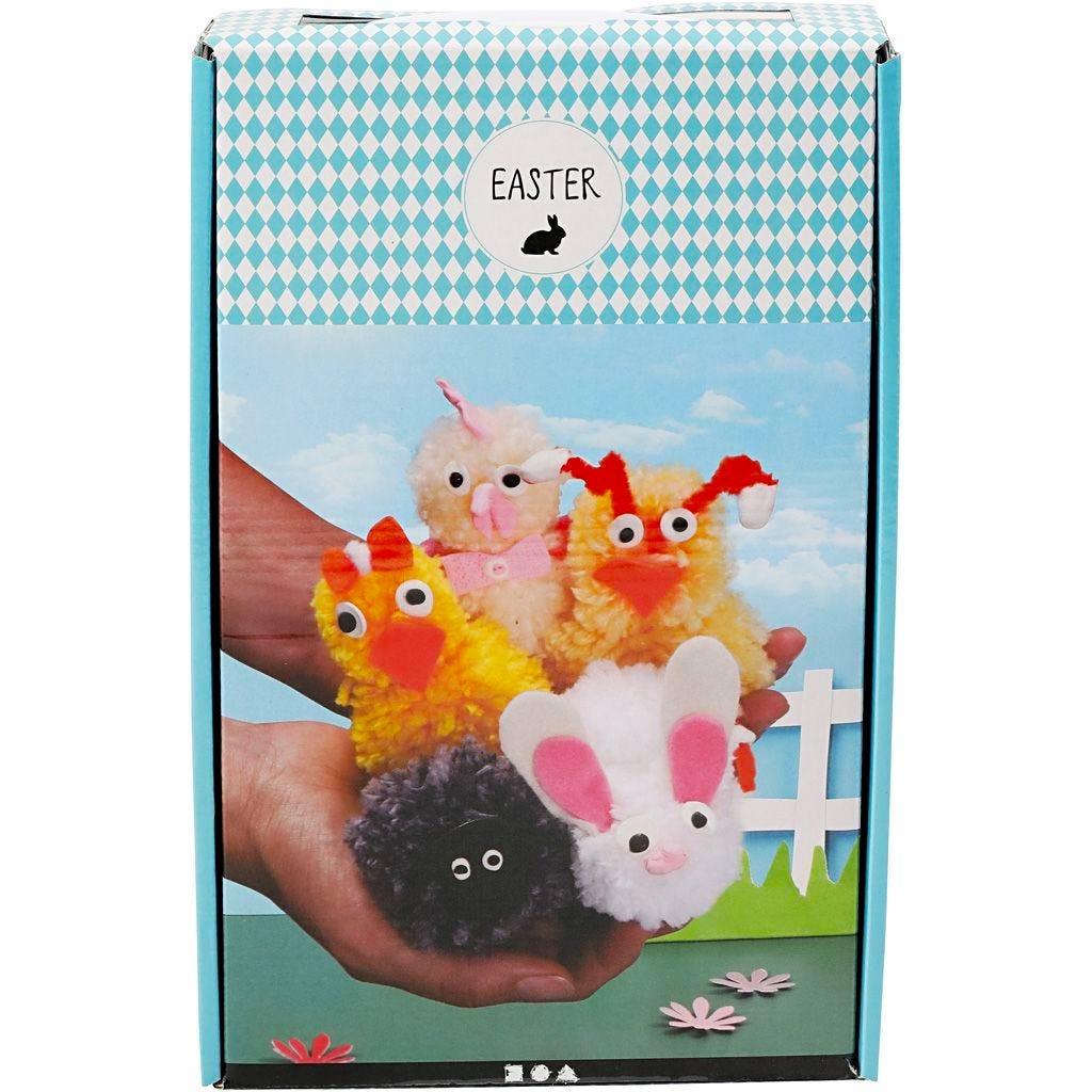 Colourful rectangular box with an image of hands holding 5 pom-pom creatures.
