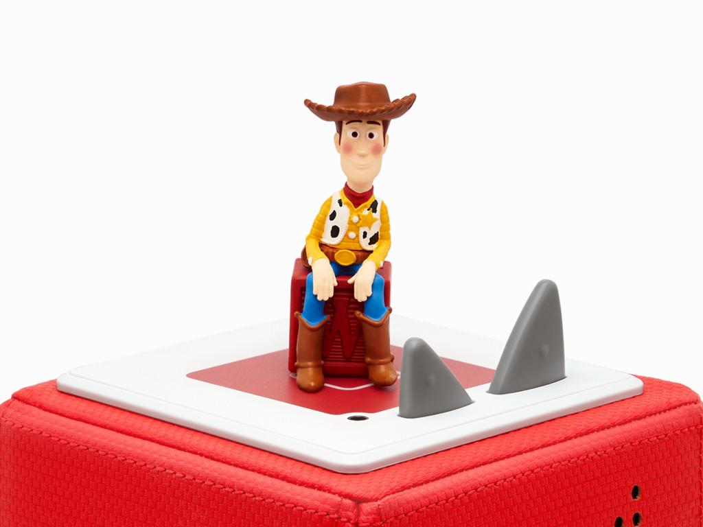 Woody Tonie figure sitting on the top of a red Toniebox..