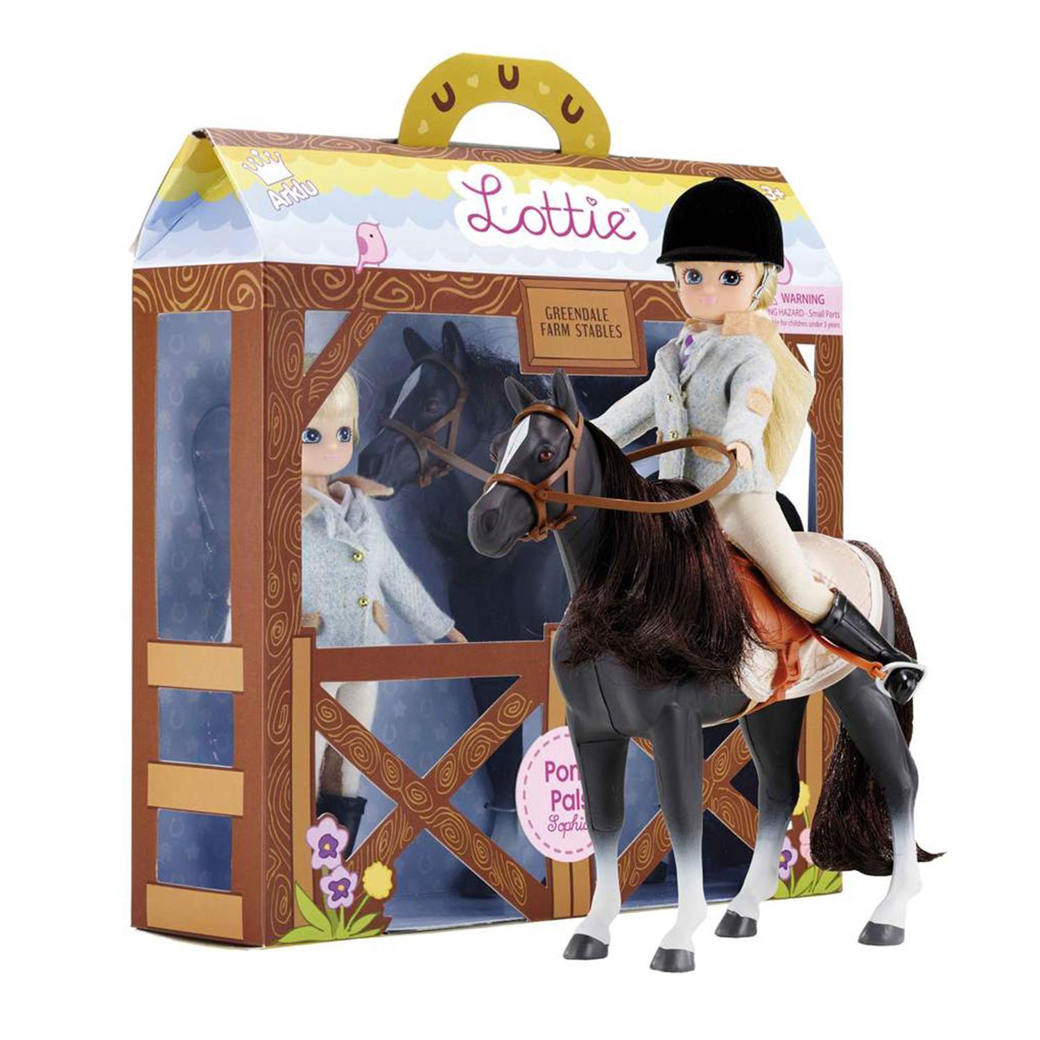 Lottie sitting on top of her pony alongside manufacturer's packaging.