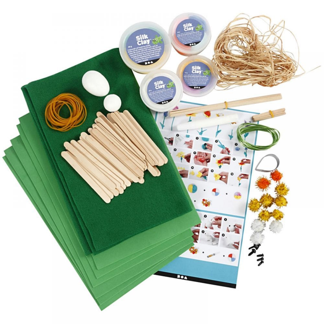Contents of Easter garden modelling kit shown on white background.