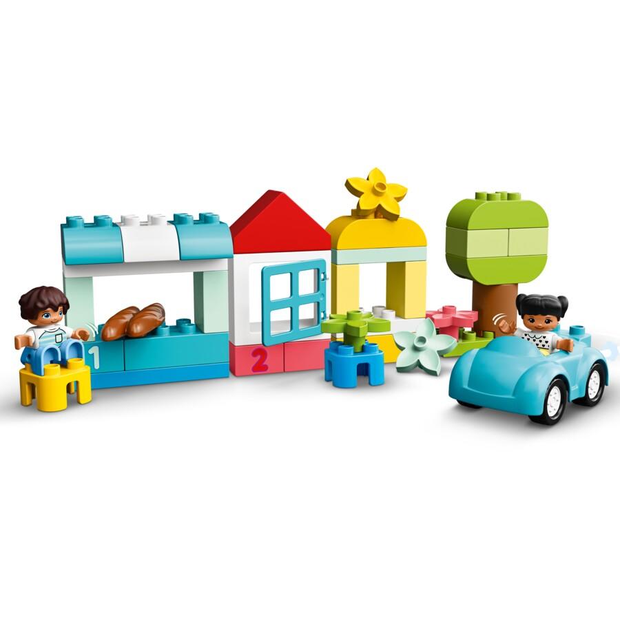 Image showing the different shapes and froms that can be made from the Duplo pieces including a pale blue car on the right hand side.