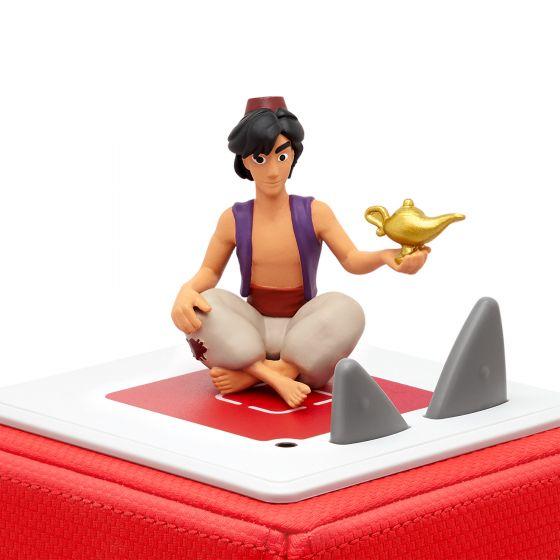 Aladdin figure sitting cross-legged on top of a red Toniebox.