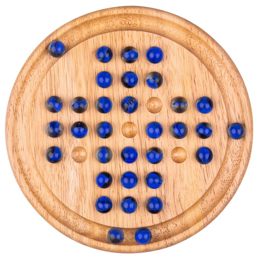 Round, wooden solitaire board with blue glass marbles.