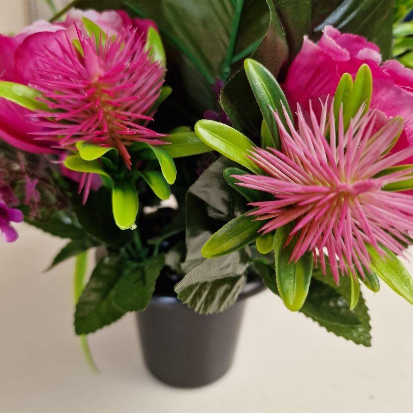 grave flower pot with artificial flowers